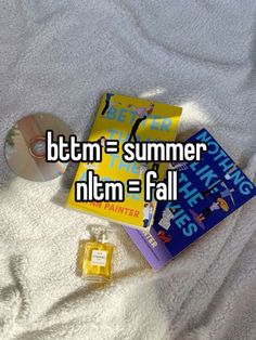 some books and a cd on a bed with the words btm = summer nitm = fall