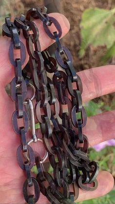 "Antique Victorian Vulcanite link chain necklace with paperclip clasp. These antique necklaces were commonly worn in the early 1800's as black mourning jewelry & Monks also wore them long, typically with a large cross. The necklace is light weight and can possibly be doubled depending on your neck size.  Era: Victorian 1840.  Size: 33.5\" long. individual links are 1.4cm x 9mm.  Materials: Vulcanite links & silver metal components.  Hallmarks: none.  Condition: Great condition with a few flee bites here and there towards the end links where the clasp meets. Links are mostly black & dark brown." Antique Necklaces, Link Chain Necklace, Antique Necklace, Antique Diamond, Heart Locket, Sterling Silver Heart, Chain Link Necklace, Antique Victorian, Paper Clip