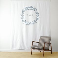 a chair sitting in front of a wall with an e + a sign on it