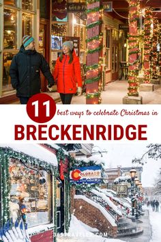 two people walking down the street in front of stores with christmas decorations and lights on them