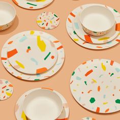 paper plates and bowls with sprinkles on them