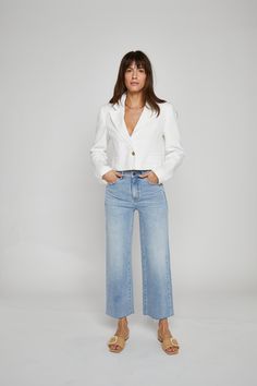 Worn in every season and loved by Every Body. High rise, wide leg, fitted where you want and cropped at the ankle with a flare to finish. She's the perfect year-round jean. We love this style paired with a white button down and a heel for a polished look at office and beyond. High rise Fitted through the hip Zipper fly Wide leg with a raw hem Sustainably made from a not too heavy & softer than most recycled cotton fabrication with 1% comfort stretch. Rise 11.5" Leg Opening 14.0" Inseam 26.5" Best Travel Pants, Cropped Denim Pants, High Noon, High Rise Wide Leg Jeans, Travel Pants, Aperol Spritz, Dark Jeans, Customer Feedback, Aberdeen