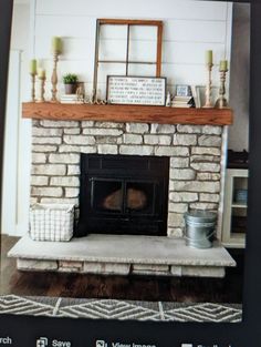 a fire place sitting in the middle of a living room next to a tv mounted on a wall