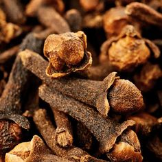 cloves are piled on top of each other in this close - up photo