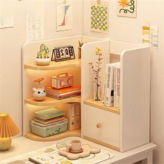 an open book shelf in the corner of a room with books and other items on it