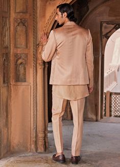 This exquisite Rose Brown Embroidered Shirt Set with Jacket is a harmonious blend of traditional elegance and contemporary design. Crafted from luxurious linen silk, it features a tailored rose brown jacket adorned with intricate geometric pattern embroidery. Paired with a subtly embellished shirt that adds a refined touch with its meticulously crafted border detail, the ensemble is completed with matching pants, exuding a sense of understated opulence. Perfect for Mehndi, Sangeet, or as wedding guest attire, this outfit combines comfort with style, ensuring you make a lasting impression. The soft, natural tones enhance the richness of the fabric, making this a versatile addition to any wardrobe. Composition : Jacket, Shirt and Pants - Linen Silk Care: Dry Clean Only and Vacuum Storage Del Elegant Silk Nehru Jacket For Festive Occasions, Elegant Nehru Jacket With Resham Embroidery For Fall, Designer Tailored Outerwear For Festive Occasions, Designer Tailored Outerwear For Festive Season, Elegant Silk Nehru Jacket, Elegant Fitted Raw Silk Bandhgala, Fitted Silk Sherwani For Formal Occasions, Elegant Silk Nehru Jacket With Intricate Embroidery, Elegant Silk Nehru Jacket With Long Sleeves