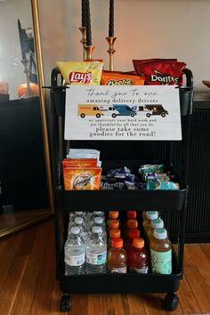 a cart filled with drinks and condiments on top of a hard wood floor