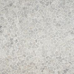 a white and grey tile wallpaper with small rocks