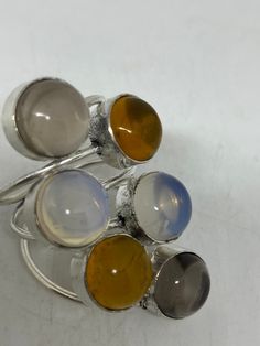 Vintage genuine Citrine, Topaz, Moonstone Silver Adjustable Cocktail ring Size 7-11 genuine citrine Low content silver not sterling. All rings are shipped free in the US in a nice gift box. Check out our over a THOUSAND great reviews Engraving is $4 per letter and is not always perfect depending on the piece. It can take a few days if the jeweler is busy. This is payable to Paypal Judithsltd@gmail.com Natural Topaz Ring Gift, Silver Topaz Ring With Natural Stones As Gift, Silver Multi-stone Moonstone Ring As Gift, Adjustable Multi-stone Moonstone Ring Gift, Round Citrine Gemstone, Spiritual Multi-stone Moonstone Ring, Heart Locket, Red Garnet, 7 11