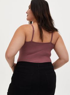 Our Tunic Foxy Cami is soft, versatile, and bound to become a key styling piece for your favorite longline looks. Foxy knit fabric. Scoop neck. Sleeveless; adjustable straps. Fitted. CONTENT + CARE Cotton/spandex. Wash cold; dry low. Imported plus size tops. SIZE + FIT Model is 5'11”, size 1. Size 2 measures 34” from shoulder. The best plus size women's foxy tunic cami in rose brown made of foxy. Rock your look from Torrid to Festivals like Coachella and Lollapalooza, a concert, a show, or just for fun! Torrid is your destination for cozy fall and winter clothes to keep you warm and comfortable. Rosé Brown, Winter Clothes, Cozy Fall, Plus Size Tops, Cotton Spandex, Basic Tank Top, Knit Fabric, Winter Outfits, Fitness Models