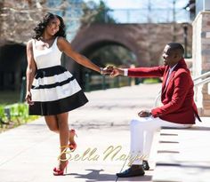 a man kneeling down next to a woman in a black and white dress holding hands