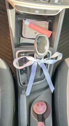 the interior of a car with an assortment of items on it's dash board