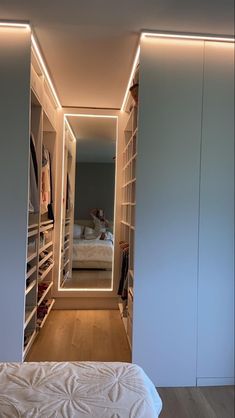 a bedroom with white walls and built in closets