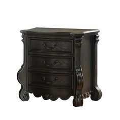 an antique style night stand with three drawers