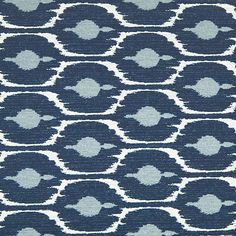 an upholstered blue and white pattern on fabric