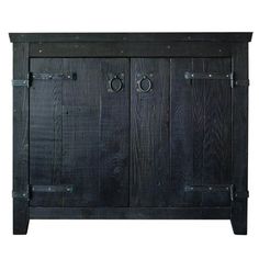 an old wooden cabinet with metal handles