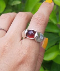 This ring has a cabochon cut hessionite garnet set with thick shoulder prongs. A nice warm orangy red gemstone, with a lot of life inside of it. Mali Garnet, Pewter Ring, Bubble Ring, Resize Ring, Garnet Gem, Red Gemstones, Ring Photos, Signet Ring, Rings Statement