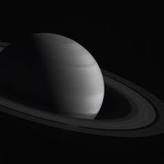 saturn with its rings in black and white