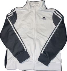 White Long Sleeve Track Jacket For Outdoor, White Winter Track Jacket With Ribbed Cuffs, White Adidas Track Jacket For Outdoor, White Track Jacket For Winter Streetwear, White Winter Track Jacket For Streetwear, White Casual Track Jacket For Winter, Casual White Adidas Track Jacket, Adidas Casual White Track Jacket, White Track Jacket With Ribbed Cuffs For Outdoor