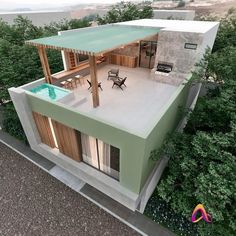 an aerial view of a house with a pool