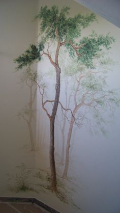 a wall mural with trees painted on it