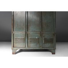 an old metal cabinet with two doors on one side and three drawers on the other