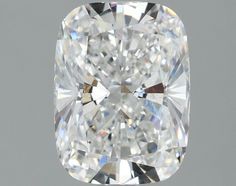 a cushion cut diamond on a gray background