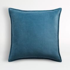 a blue pillow on a white background