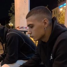 two young men sitting next to each other