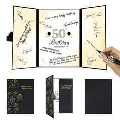 a hand holding a pen and writing on a 50th birthday card