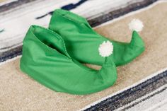 a green hat laying on top of a rug