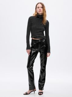 Fit: A full-length slim fit with a mini bootcut leg. ​ Fabric: 100% Polyester.  Stretch: No-Stretch Pants.  Rise: Mid Rise Jeans.  Look: A classic five-pocket pant in vegan patent leather.  Details: Zip fly & five-pocket styling.  Our Mid Rise Jean has a 10" 25 cm) rise. ​ Slim through the hip & thigh.  Mini bootcut leg. ​​ 17. 5" 44 cm) leg opening.  Full-length jean Inseam: Petite 27. 5" 67. 5 cm), Short 28. 5" 72 cm), Regular 30" 76 cm), Long 32" 81 cm), Tall 34″ 86 cm).  Models wearing Gap Flare Black Pants, Boot Pants, Black Cotton Dresses, Jeans Look, Bloomers Shorts, Bootcut Jean, Leather Baby, Burberry Jacket, Stretchy Jeans