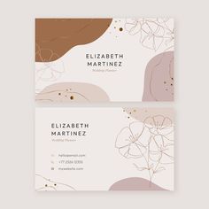 two business cards with abstract shapes and gold foil on the bottom, one is pink