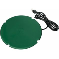 a green round object with power cord attached to it