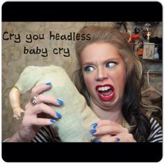 a woman holding a stuffed animal in her hands with the caption cry you headless baby cry