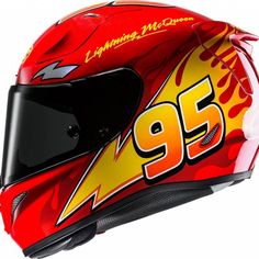 a red helmet with flames on the side and number 95 written on it, sitting in front of a white background