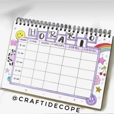 a planner with the words work on it and an image of a rainbow - colored smiley face