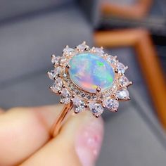 Welcome to Elegant Art Jewelry!  Stone: Natural Opal Stone Size:. 9mm×11mm Side Stone:. Zirconia Metal: 925 Sterling Silver Plating: Platinum Plated Personalization: 9K/14K/24K/GOLD/SILVER/PLATINUM/ROSE-GOLD/WHITE GOLD. (Contact me)  Opal Ring, Opal Cuff Ring, 925 Sterling Silver Ring, Oval Shape Ring, Opal Ring, Opal Engagement, Open Design Ring, Opal Oval, Opal Natural, White Opal, White Gemstone, Gemstone Ring, Engagement Ring, Wedding Ring, Statement Ring, Opal Ring, Victorian Ring, Opal Eng Opal Ring With Cubic Zirconia And Halo Setting, Formal Opal Ring With Cubic Zirconia, Fine Jewelry Opal Ring With Cubic Zirconia, Round Opal Ring With Cubic Zirconia Accent Stones, Brilliant Cut Opal Ring Gift, Pear Halo Ring, Wedding Ring Luxury, 33 Birthday, Natural Opal Ring