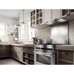 a modern kitchen with stainless steel appliances and wood cabinets