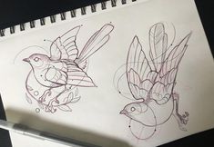 two drawings of birds sitting on top of a table next to a pen and paper