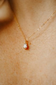 Our Tiny Teardrop Necklace is a gorgeous addition to your everyday look. The sparkling tiny teardrop charm hangs from long-lasting 14K gold filled or Sterling silver chain. This is the perfect gift for a friend (or yourself) as it is so dainty and ready for everyday wear. You really can't go wrong! Dainty Teardrop Everyday Necklace, Dainty 14k Gold Teardrop Drop Necklace, Dainty Necklace With Delicate Chain And Teardrop Pendant, Dainty Gold Chain Necklace With Teardrop Pendant, Gold Y-shape Dainty Drop Necklace, Small Gold Necklace, Gold Necklace Simple, Dainty Gold Necklace, Teardrop Necklace