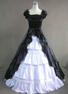 Women Black and White Gothic Victorian Dress     Description: new Black and White Gothic Victorian Dress is full of mystery and lure, both Luxuriant and dark. About death, about horror, about mystery, about riddle, these are all the Gothic lolita try to exoress. Such a ruiness feeling. new Black And White Gothic amp;nbsp;Victorian Dress features its Cuff Sleeves Ruffled Front Splitting Multi-layer Cotton Satin ,ruffled neckline. It is tailored in fine materials with dedicated handwork and constr Black Victorian Dress, Victorian Ball Gowns, Gothic Victorian Dresses, White Gothic, 18th Century Dress, Victorian Costume, Steampunk Cosplay, Elegant Gothic, Gothic Victorian