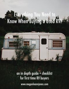 an old trailer sitting in the middle of a field with text overlay that reads, everything you need to know when buying a used rv