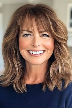 Save this pin for the best medium-length hairstyles for women over 50 with bangs. For a modern, trendy style, a textured lob with layers is the perfect choice. The layers are important in this cut: they add depth and texture. Lob With Layers, Women Over 50 With Bangs, Over 50 With Bangs, Mom Haircut, Hair Lightening, Hairstyle With Bangs, Medium Length Hairstyle, Hair And Skin Vitamins, Textured Lob