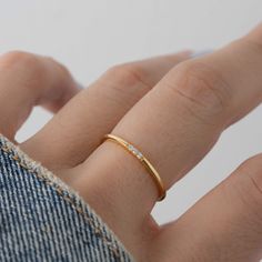 Sweet, simple, and dainty ring. Perfect for a minimalist look, or for stacking. - - - D E T A I L S - - - * Made of 925 Sterling Silver * Available in 14k Gold Plating, Rose Gold or Rhodium Plated * We use a THICK, DURABLE plating - for a piece that will last you years to come! * VERY HIGH QUALITY * Available in sizes 4-10 * Ring Width: 1.4mm * Features 3 small Cubic Zirconia Stones - made of the highest grade for an authentic diamond look! Also available in Emerald, Sapphire & Ruby! Emerald htt Simple Diamond Ring, Dainty Gold Rings, Zierlicher Ring, Simple Diamonds, 3 Stone Rings, Ringe Gold, Ruby Emerald, Demi Fine Jewelry, Round Rings