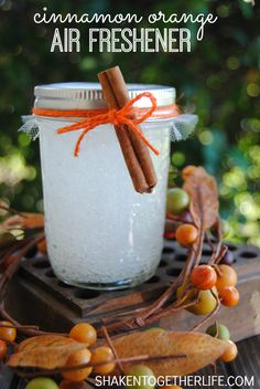 a jar filled with white liquid and cinnamon sticks