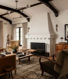 a living room filled with furniture and a fire place in the middle of a room