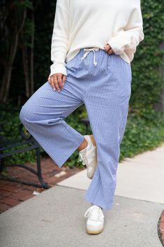 Step into effortless style with our Bayside Drawstring Bottoms, designed for the modern woman on the go. These lightweight, breathable pants offer a relaxed fit, perfect for casual outings or lounging in comfort. The adjustable drawstring waist ensures a perfect fit, while the vertical stripes elongate your silhouette, adding a touch of sophistication to your laid-back look. Pair them with a simple tee or dress them up with a chic blouse for versatile wear. These pants are an everyday essential Relaxed Drawstring Pants For Everyday, Relaxed Drawstring Bottoms, Spring Relaxed Fit Bottoms With Drawstring, Relaxed Spring Bottoms With Drawstring, Relaxed Fit Drawstring Bottoms For Spring, Summer Pants With Drawstring For Everyday Wear, Relaxed Everyday Bottoms With Drawstring, Everyday Spring Bottoms With Drawstring, Comfortable Everyday Pants With Drawstring