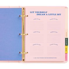 a pink and blue binder with writing on the side that says let yourself dream a little bit