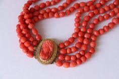 130gr Antique Faceted  Coral Necklace 4 Strands Carved Cameo 18k Yellow Gold  Gorgeous antique/vintage faceted coral necklace from natural not dyed corals. Assembled in 4 strands with knots and decorated by carved coral cameo made from yellow gold 18k. There is no hallmark, gold was tested by acid. Size of beads: 9-5mm Coral strand's length: from 59-67cm (23-26,4in ) Cameo in gold: 2,8x2,2cm / 1,12x0,88in Metal: yellow gold 18k (tested by acid) Weight: 130grams Condition: please see condition on photo! Good antique condition! Some coral beads have natural impurity. Please visit my other listings!  I have many antique and vintage coral jewelry posted on etsy. If you have any questions please feel free to ask. If you need more photos, write and me I'll send you. Our Viber What's app: +3-8-09 Vintage Coral Jewelry, Coral Jewelry Vintage, Kay Adams, Gold Bridal Jewellery Sets, Jewelry Post, Jewellery Sets, Sea Star, Coral Jewelry, Coral Necklace